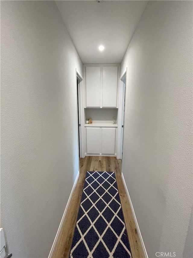 9749 Reseda Blvd Unit 13, Northridge, CA 91324 - hall with light wood-type flooring and baseboards