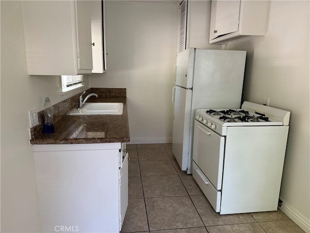 11316 Venice Blvd, Los Angeles, CA 90066 - kitchen featuring white appliances, white cabinets, dark countertops, and light tile patterned floors