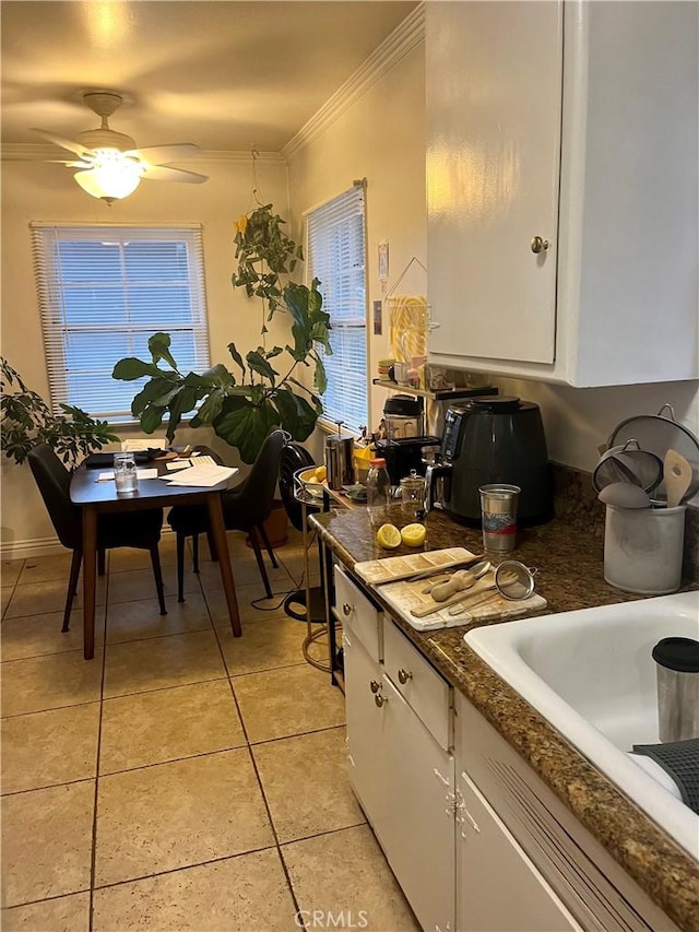 11316 Venice Blvd, Los Angeles, CA 90066 - kitchen featuring ornamental molding, white cabinetry, light tile patterned floors, and ceiling fan