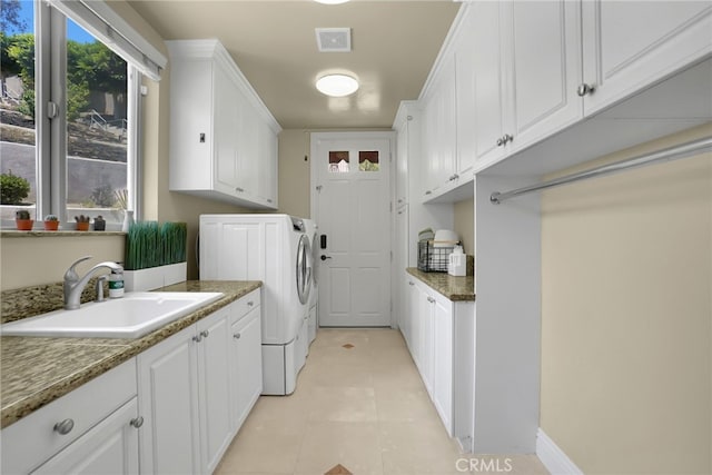15841 Aurora Crest Dr, Whittier, CA 90605 - washroom featuring cabinet space, washer and clothes dryer, and light tile patterned flooring
