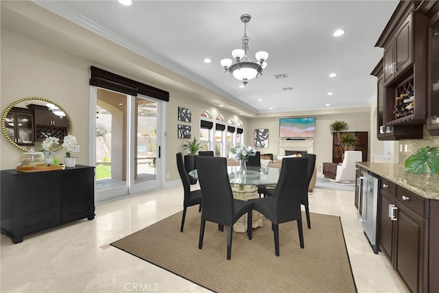 15841 Aurora Crest Dr, Whittier, CA 90605 - dining area featuring recessed lighting, a chandelier, crown molding, bar area, and wine cooler