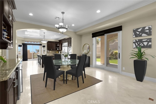 15841 Aurora Crest Dr, Whittier, CA 90605 - dining area featuring arched walkways, ornamental molding, recessed lighting, a chandelier, and wine cooler