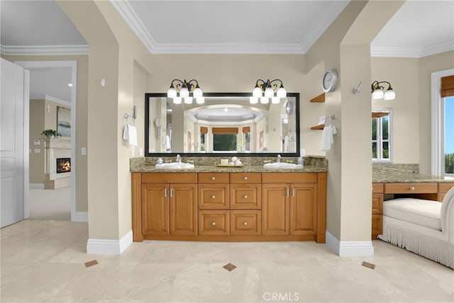 15841 Aurora Crest Dr, Whittier, CA 90605 - full bathroom with double vanity, crown molding, a lit fireplace, and tile patterned flooring