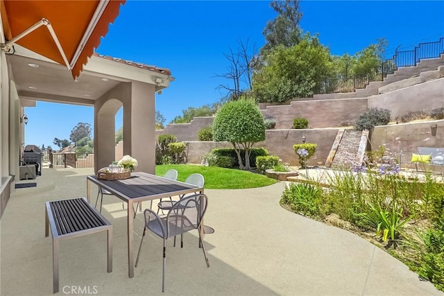 15841 Aurora Crest Dr, Whittier, CA 90605 - fenced backyard featuring a patio, stairway, and outdoor dining area