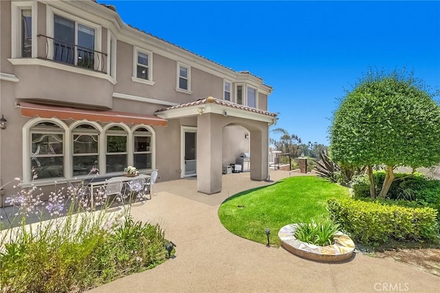 15841 Aurora Crest Dr, Whittier, CA 90605 - back of property with a patio area, stucco siding, and a tile roof