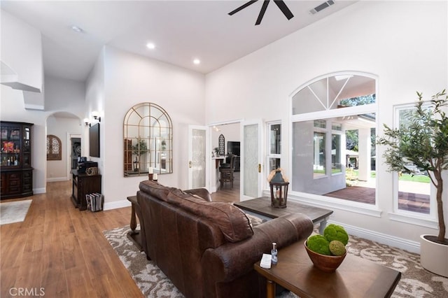 395 Mesa Rd, Nipomo, CA 93444 - living room with a high ceiling, ceiling fan, arched walkways, light wood-style flooring, and recessed lighting
