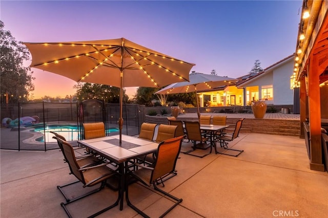 395 Mesa Rd, Nipomo, CA 93444 - patio terrace at dusk featuring outdoor dining space and a patio