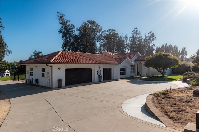 395 Mesa Rd, Nipomo, CA 93444 - mediterranean / spanish-style house with a tiled roof, a garage, concrete driveway, and stucco siding