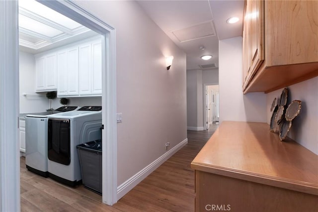 395 Mesa Rd, Nipomo, CA 93444 - laundry area featuring attic access, washer and clothes dryer, cabinet space, and light wood-style floors