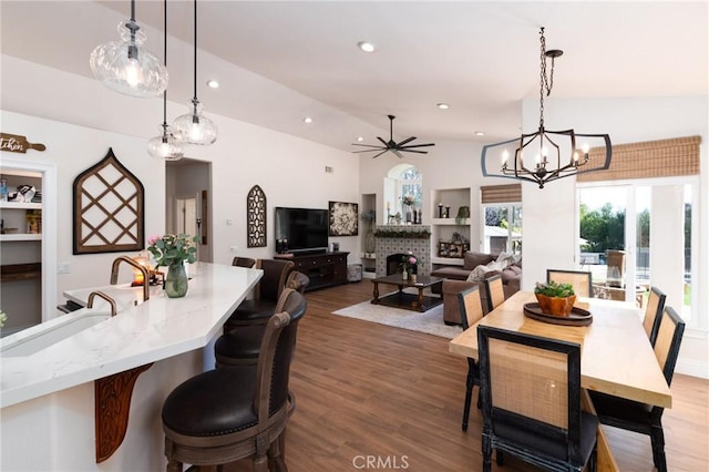 395 Mesa Rd, Nipomo, CA 93444 - dining room with a brick fireplace, wood finished floors, ceiling fan, recessed lighting, and a chandelier