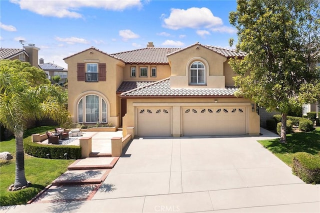 23665 Ridgecrest Ct, Diamond Bar, CA 91765 - mediterranean / spanish-style house featuring stucco siding, driveway, a garage, and a tile roof