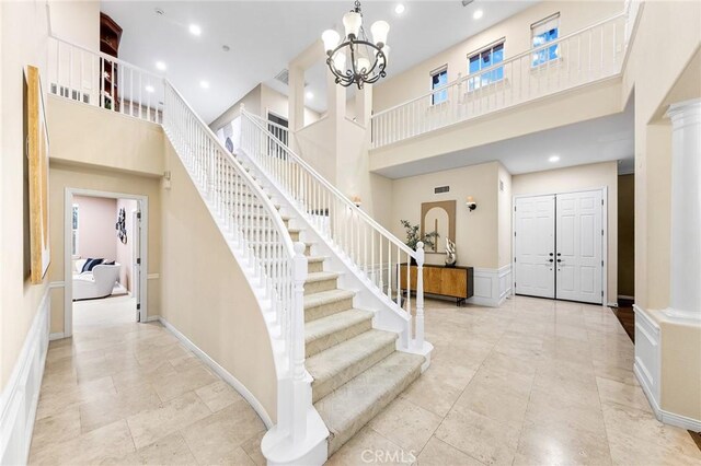 23665 Ridgecrest Ct, Diamond Bar, CA 91765 - foyer entrance featuring a towering ceiling, stairway, a chandelier, and recessed lighting
