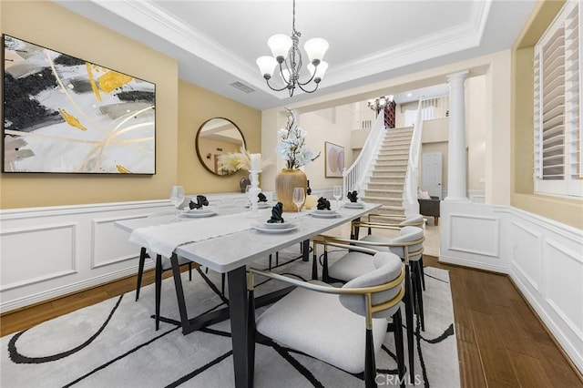 23665 Ridgecrest Ct, Diamond Bar, CA 91765 - dining room featuring a raised ceiling, a chandelier, dark wood finished floors, a decorative wall, and ornamental molding