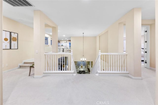 23665 Ridgecrest Ct, Diamond Bar, CA 91765 - hallway with carpet floors, a chandelier, and an upstairs landing