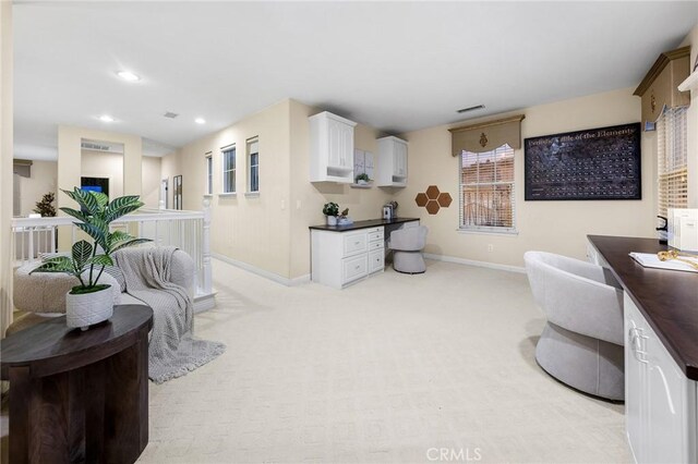 23665 Ridgecrest Ct, Diamond Bar, CA 91765 - living area with light carpet, recessed lighting, and built in desk