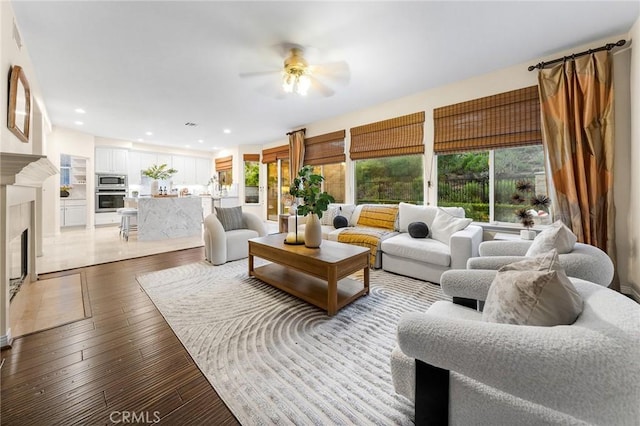 23665 Ridgecrest Ct, Diamond Bar, CA 91765 - living room featuring a ceiling fan, a fireplace with flush hearth, light wood-style flooring, and recessed lighting