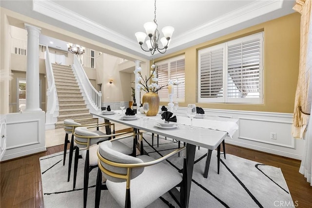 23665 Ridgecrest Ct, Diamond Bar, CA 91765 - dining room with a chandelier, ornamental molding, a wainscoted wall, wood finished floors, and healthy amount of natural light