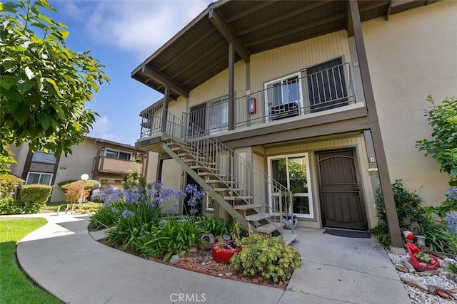 23326 Sesame St Unit E, Torrance, CA 90502 - doorway to property with a balcony and stucco siding