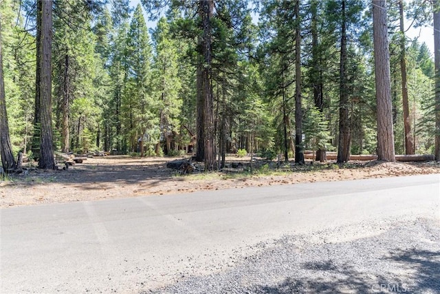 7472 Humboldt Rd, Butte Meadows, CA 95942 - view of asphalt road featuring a wooded view