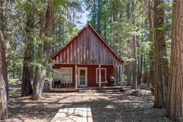 7472 Humboldt Rd, Butte Meadows, CA 95942 - view of outbuilding featuring covered porch and a view of trees