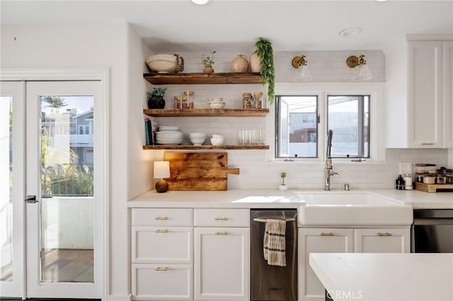 1722 Harper Ave, Redondo Beach, CA 90278 - kitchen featuring decorative backsplash, white cabinets, light countertops, and healthy amount of natural light