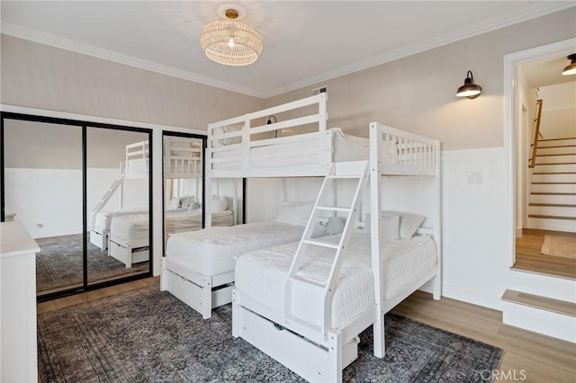 1722 Harper Ave, Redondo Beach, CA 90278 - bedroom featuring wood finished floors, crown molding, and multiple closets