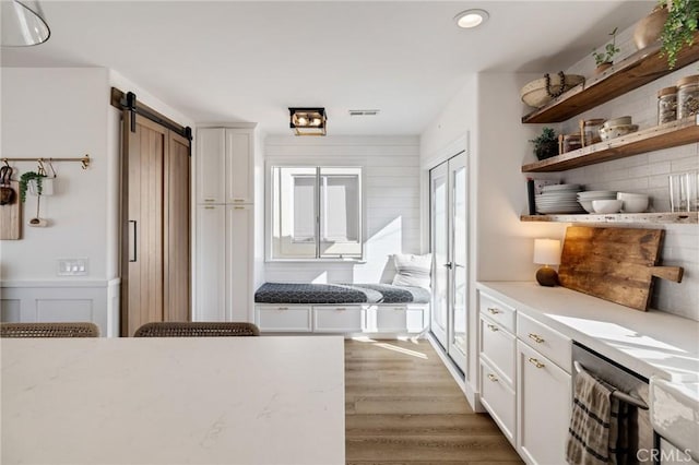 1722 Harper Ave, Redondo Beach, CA 90278 - hall with a barn door, light wood finished floors, and recessed lighting