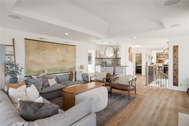1722 Harper Ave, Redondo Beach, CA 90278 - living room featuring a raised ceiling, light wood-style flooring, a chandelier, and recessed lighting