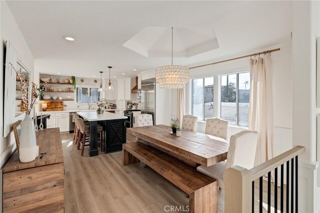 1722 Harper Ave, Redondo Beach, CA 90278 - dining area featuring a chandelier, light wood-type flooring, recessed lighting, and a tray ceiling
