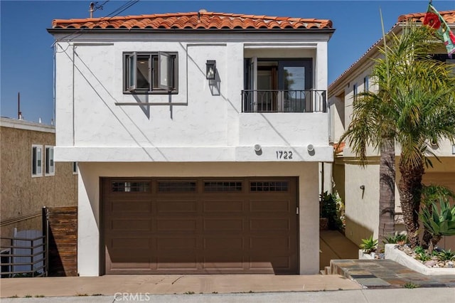 1722 Harper Ave, Redondo Beach, CA 90278 - mediterranean / spanish house featuring stucco siding, a tiled roof, and an attached garage