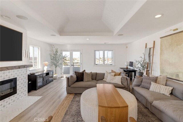 1722 Harper Ave, Redondo Beach, CA 90278 - living room with plenty of natural light, a raised ceiling, light wood finished floors, a tiled fireplace, and recessed lighting
