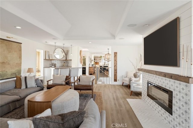 1722 Harper Ave, Redondo Beach, CA 90278 - living room with light wood-style floors, a tile fireplace, and recessed lighting