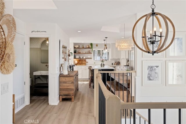 1722 Harper Ave, Redondo Beach, CA 90278 - corridor featuring light wood-style floors, a chandelier, an upstairs landing, and recessed lighting