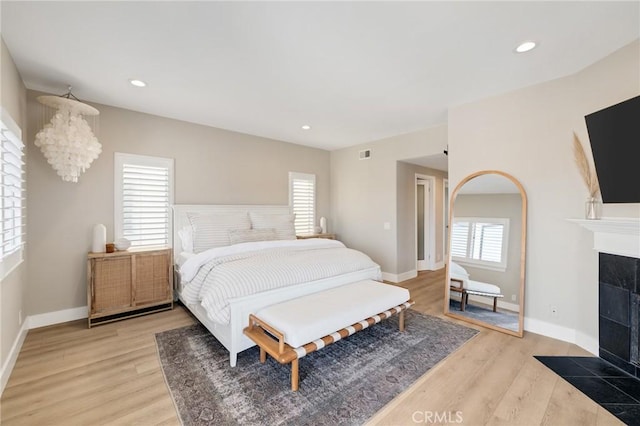 1722 Harper Ave, Redondo Beach, CA 90278 - bedroom with a tile fireplace, light wood-type flooring, and recessed lighting