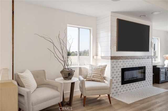 1722 Harper Ave, Redondo Beach, CA 90278 - sitting room with light wood finished floors and a tiled fireplace