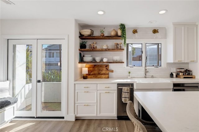 1722 Harper Ave, Redondo Beach, CA 90278 - kitchen featuring healthy amount of natural light, white cabinetry, light countertops, tasteful backsplash, and recessed lighting