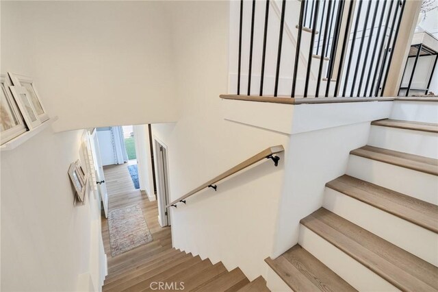 1722 Harper Ave, Redondo Beach, CA 90278 - stairs featuring wood finished floors and a towering ceiling