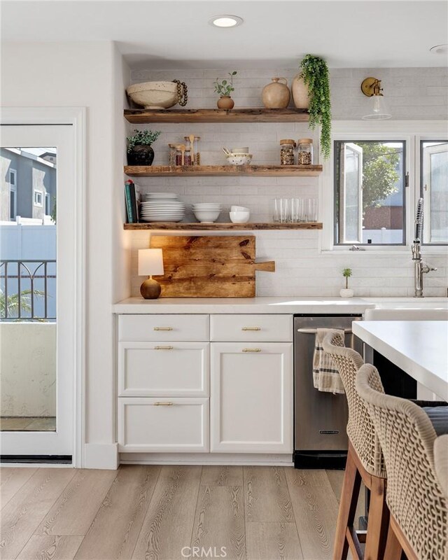 1722 Harper Ave, Redondo Beach, CA 90278 - bar area with stainless steel dishwasher, light wood finished floors, recessed lighting, and tasteful backsplash