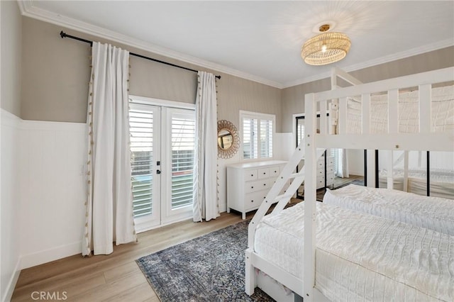 1722 Harper Ave, Redondo Beach, CA 90278 - bedroom featuring ornamental molding, access to exterior, wood finished floors, and a wainscoted wall