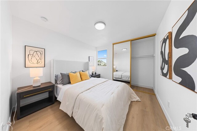 25885 Astor Way, Lake Forest, CA 92630 - bedroom featuring light wood finished floors and a closet