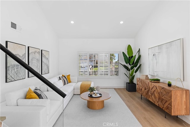 25885 Astor Way, Lake Forest, CA 92630 - living area featuring wood finished floors, vaulted ceiling, and recessed lighting