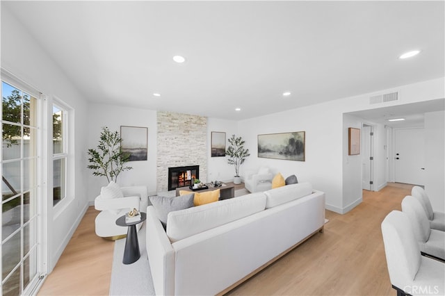 25885 Astor Way, Lake Forest, CA 92630 - living room featuring light wood-style flooring, a fireplace, and recessed lighting
