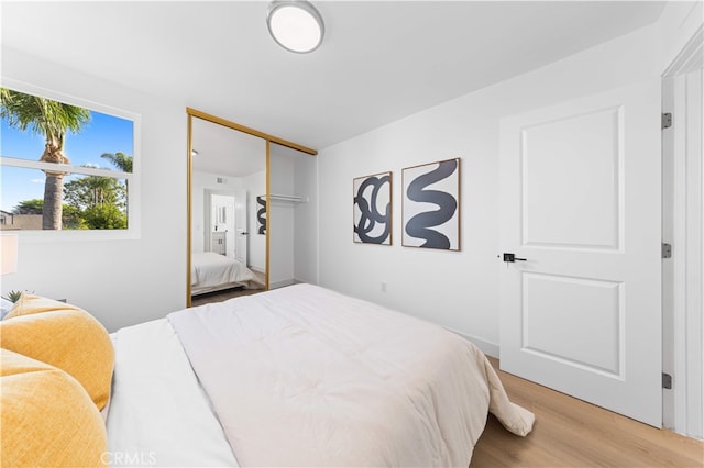 25885 Astor Way, Lake Forest, CA 92630 - bedroom with light wood finished floors and a closet