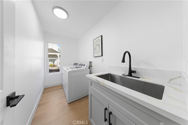 25885 Astor Way, Lake Forest, CA 92630 - laundry room with washer and dryer, cabinet space, and light wood finished floors