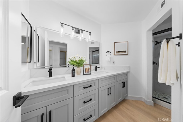 25885 Astor Way, Lake Forest, CA 92630 - full bath with double vanity, wood finished floors, and walk in shower