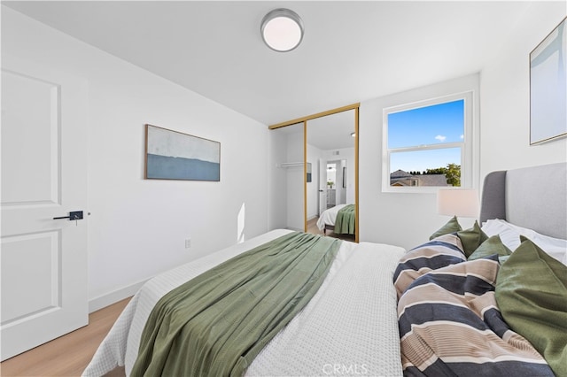 25885 Astor Way, Lake Forest, CA 92630 - bedroom featuring light wood finished floors and a closet