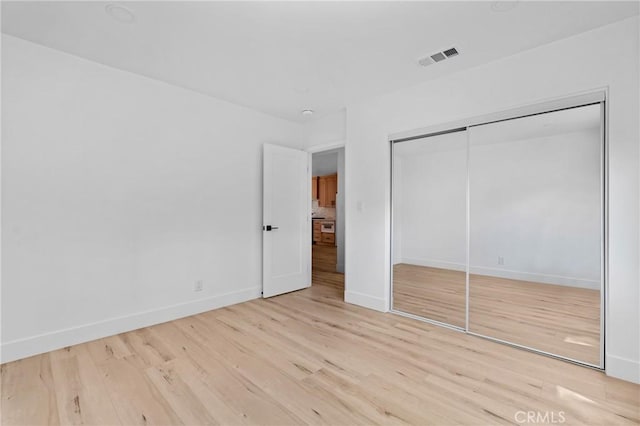 151 Barret Rd, Riverside, CA 92507 - unfurnished bedroom featuring wood finished floors and a closet