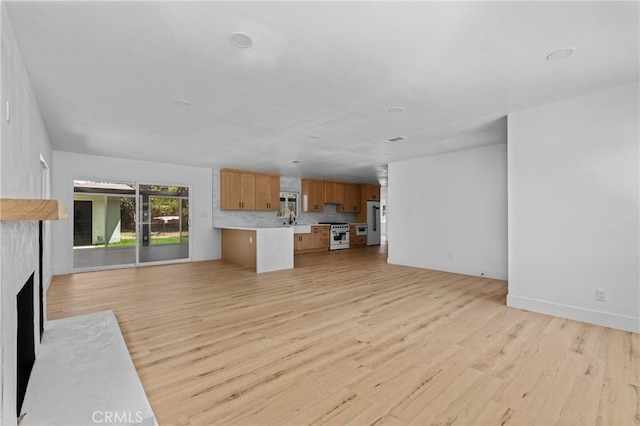 151 Barret Rd, Riverside, CA 92507 - unfurnished living room with light wood-type flooring and a fireplace