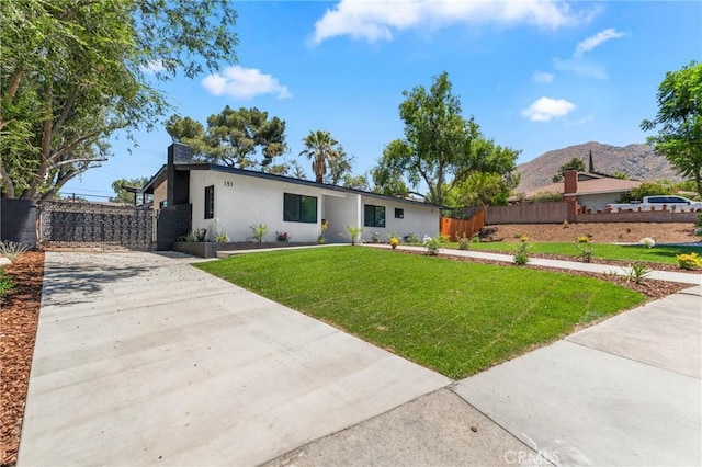 151 Barret Rd, Riverside, CA 92507 - view of front facade featuring stucco siding, a mountain view, and concrete driveway