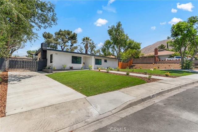 151 Barret Rd, Riverside, CA 92507 - view of front of home featuring stucco siding, concrete driveway, and a mountain view